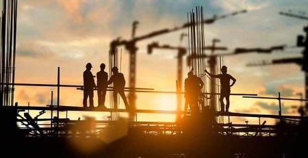 Building Tomorrow: Innovations in Multistory Construction; Silhouette of engineer and construction team working at site over blurred background for industry background with Light fair.Create from multiple reference images together